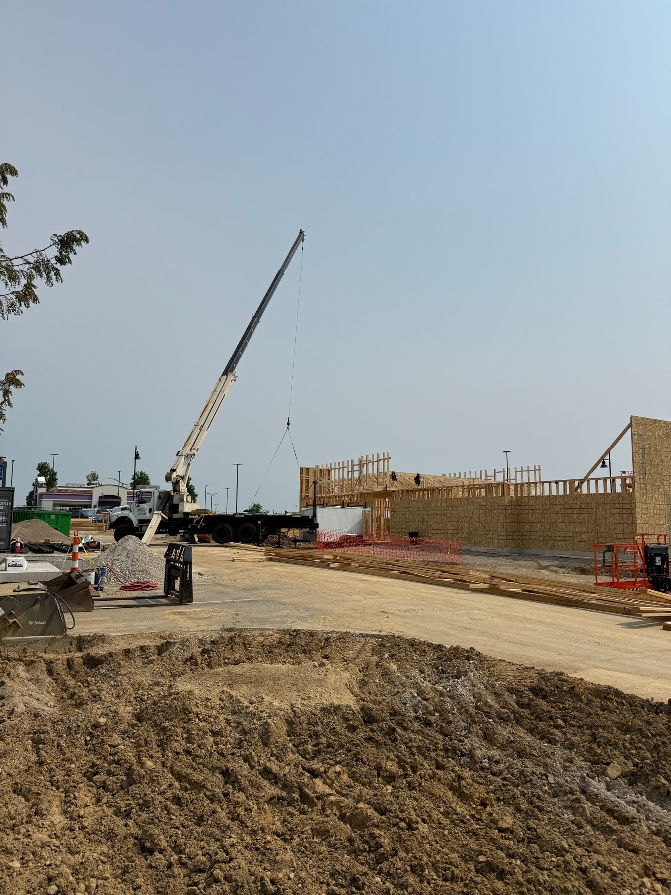 Crane working at a construction framing site